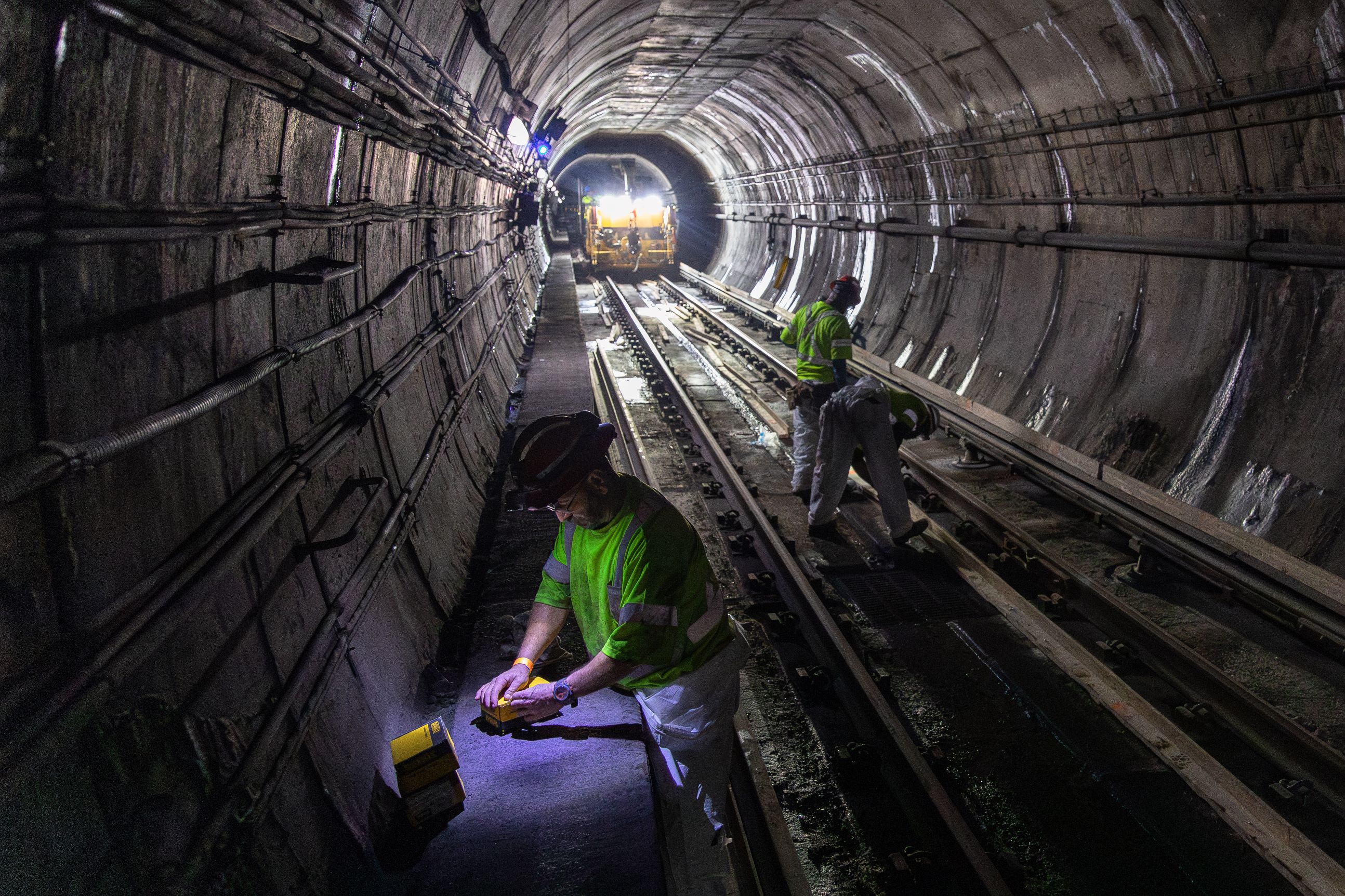 Crews work in the Red Line tunnel during the closure.