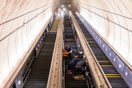 Crews work on the escalators at the Wheaton Metrorail station.