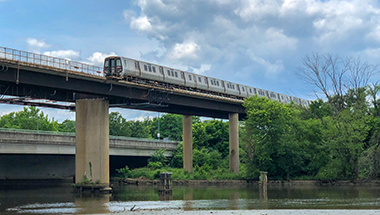 Train crossing over bridge structure
