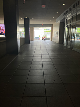 A picture of the pathway from the top of the escalators to the sidewalk of D St.